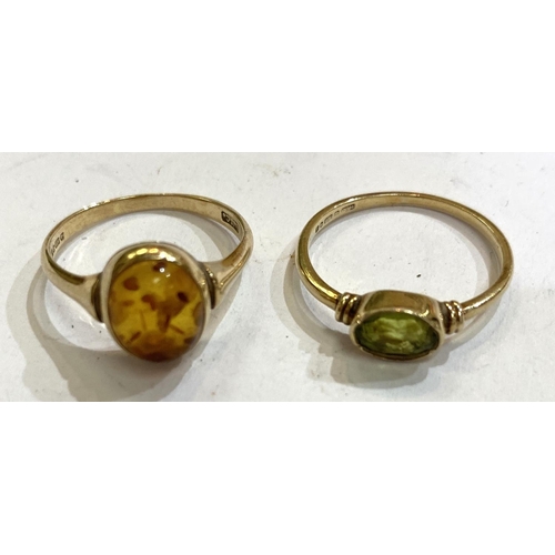 768 - A 9 carat hallmarked gold dress ring with a peridot coloured stone, size 'N-O', 1.7gms; a hallmarked... 