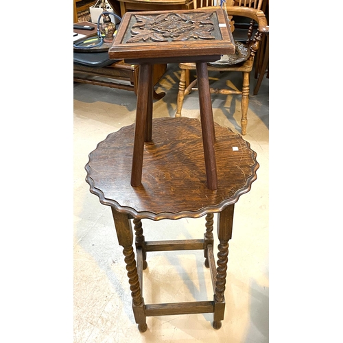 886 - A 1930's oak occasional table with circular scalloped top on barley twist legs; a small carved plant... 