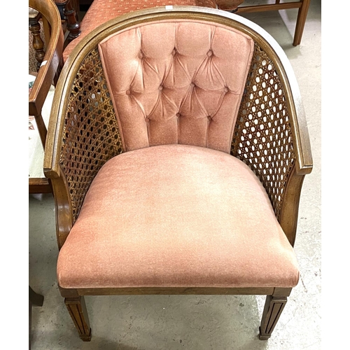 963 - An early 20th century stained walnut tub shaped armchair with cane and buttoned pink back; a 1920's ... 