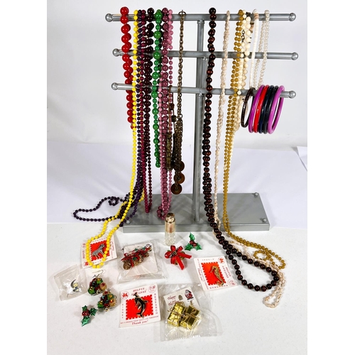 19 - A large selection of modern costume jewellery to include bead necklaces, shell necklace, bracelets a... 