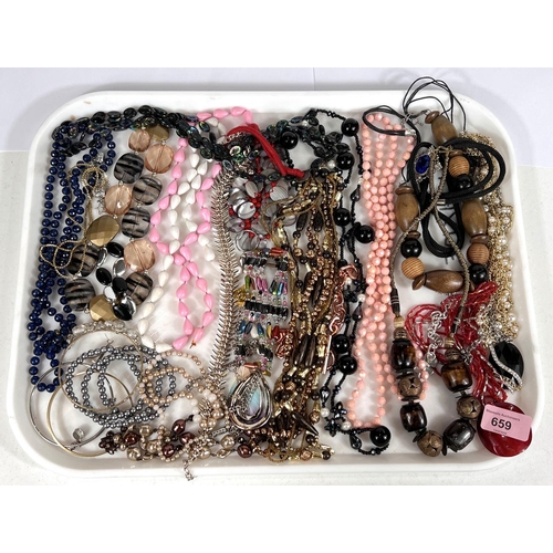 19 - A large selection of modern costume jewellery to include bead necklaces, shell necklace, bracelets a... 