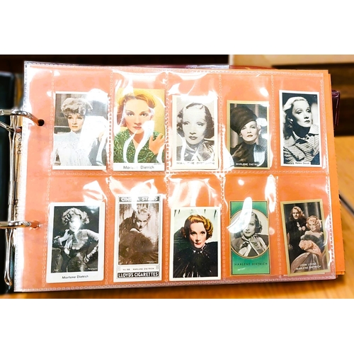 151 - Two albums containing a collection of cards; etc., relating to Marlene Dietrich, one 15 pages, one 2... 