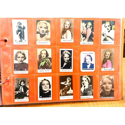 151 - Two albums containing a collection of cards; etc., relating to Marlene Dietrich, one 15 pages, one 2... 