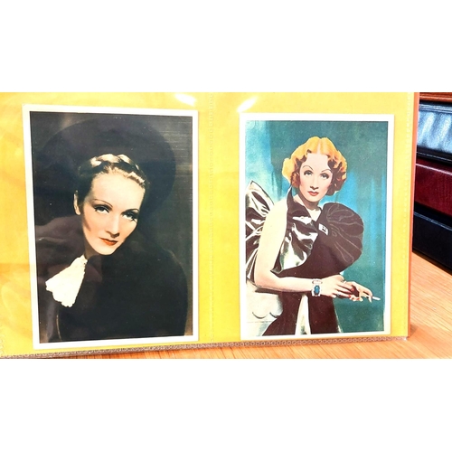 151 - Two albums containing a collection of cards; etc., relating to Marlene Dietrich, one 15 pages, one 2... 