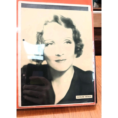 151 - Two albums containing a collection of cards; etc., relating to Marlene Dietrich, one 15 pages, one 2... 