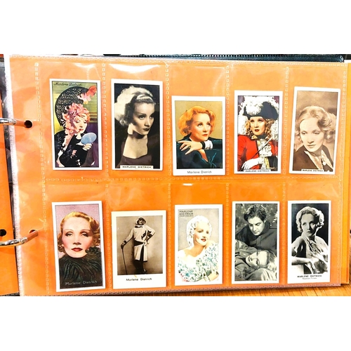 151 - Two albums containing a collection of cards; etc., relating to Marlene Dietrich, one 15 pages, one 2... 