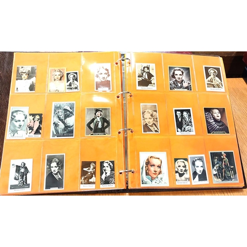 151 - Two albums containing a collection of cards; etc., relating to Marlene Dietrich, one 15 pages, one 2... 