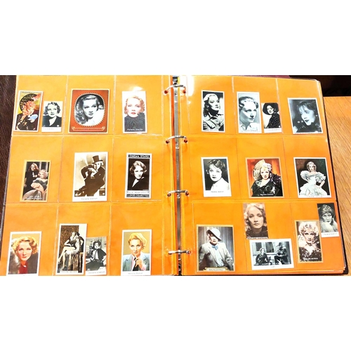 151 - Two albums containing a collection of cards; etc., relating to Marlene Dietrich, one 15 pages, one 2... 