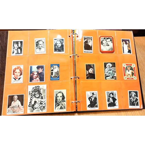 151 - Two albums containing a collection of cards; etc., relating to Marlene Dietrich, one 15 pages, one 2... 