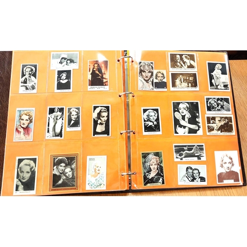 151 - Two albums containing a collection of cards; etc., relating to Marlene Dietrich, one 15 pages, one 2... 