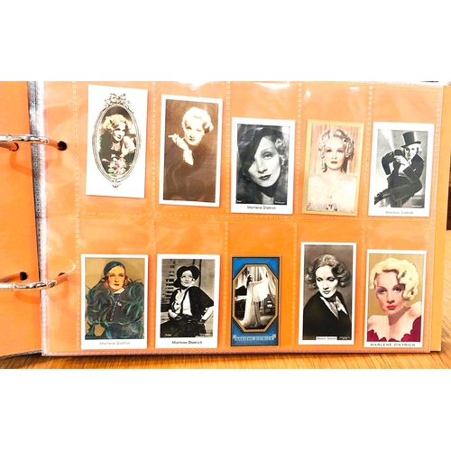 151 - Two albums containing a collection of cards; etc., relating to Marlene Dietrich, one 15 pages, one 2... 