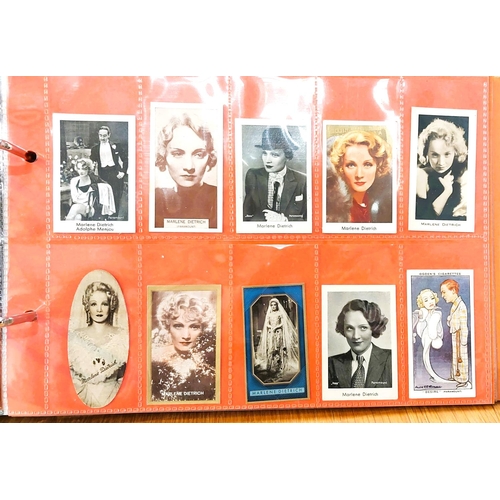 151 - Two albums containing a collection of cards; etc., relating to Marlene Dietrich, one 15 pages, one 2... 