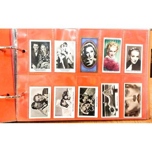 151 - Two albums containing a collection of cards; etc., relating to Marlene Dietrich, one 15 pages, one 2... 