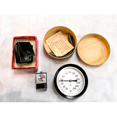 35 - A circular vintage Swedish Fahrenheit thermometer in original box; a STOWA miniature wind up clock/a... 