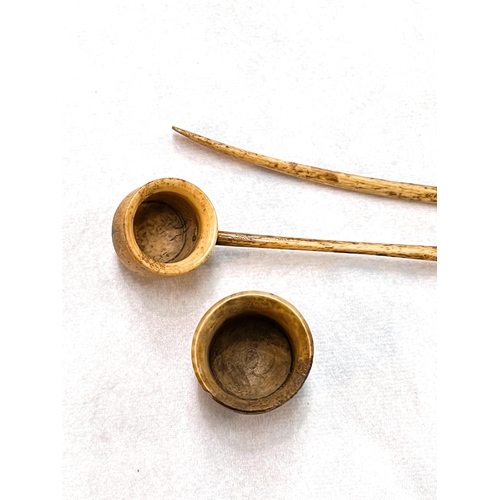 36 - A pair of antique bone tobacco pipes