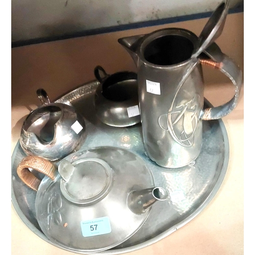 57 - A four piece Liberties Tudric pewter tea service with teapot, hot water jug, milk and sugar No 0231,... 