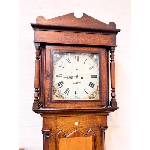 942 - An early 19th century oak and mahogany longcase clock with architectural pediment and turned columns... 