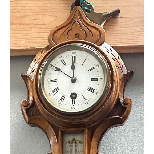 1 - A late Victorian unusual clock/barometer in carved walnut 'anchor' surround, with thermometer
