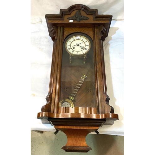 11 - A 19th century Vienna wall clock in walnut case, spring driven with strike
