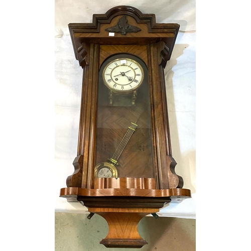 11 - A 19th century Vienna wall clock in walnut case, spring driven with strike