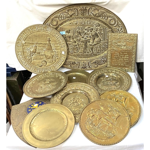 27 - A good collection of brass traditional wall plaques, circular and shield shaped; a collection of bri... 