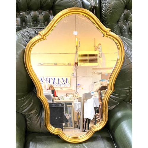4 - A wall mirror in black & gilt reeded frame; a mirror in shaped period style gilt frame