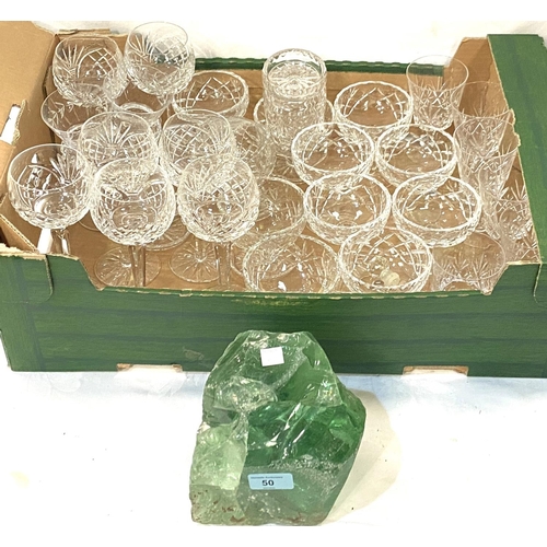 50 - A green glass paperweight/doorstop and a selection of various drinking glasses