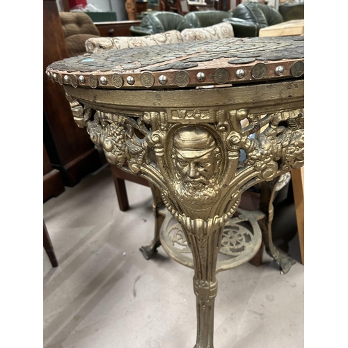 943 - A 19th century Britannia style pub table with a depiction of the head of W.G. Grace, the cricketer, ... 