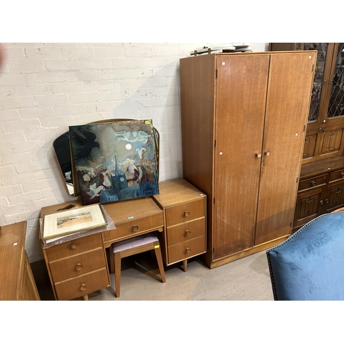 947 - A mid 20th century light oak dressing table and matching double wardrobe