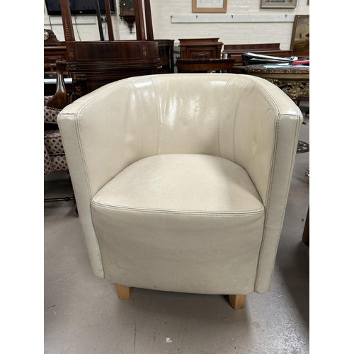 960 - A modern tub shaped armchair in cream