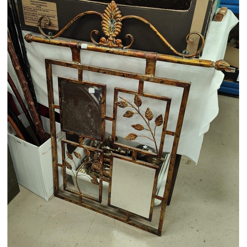 13A - A wrought gilt metal firescreen with mirror and leaf panels; a large selection of brass candlesticks... 