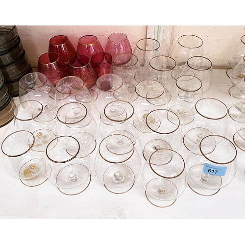 617 - A selection of mid 20th century clear and ruby oloured brandy glasses with gilt rims