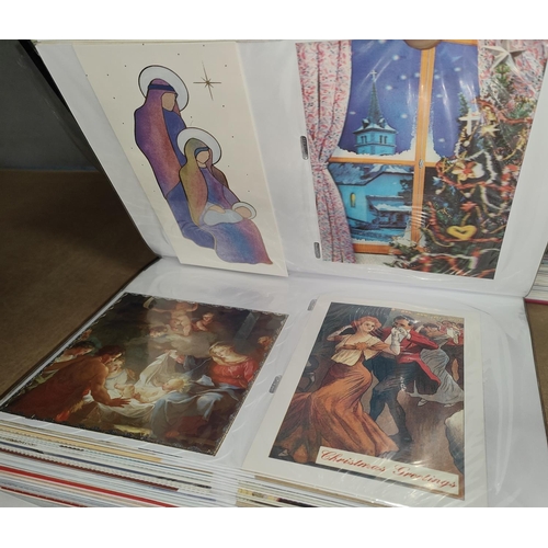 218 - An album containing early 20th century prayer postcards; Bell's New French picture cards; etc.; an a... 