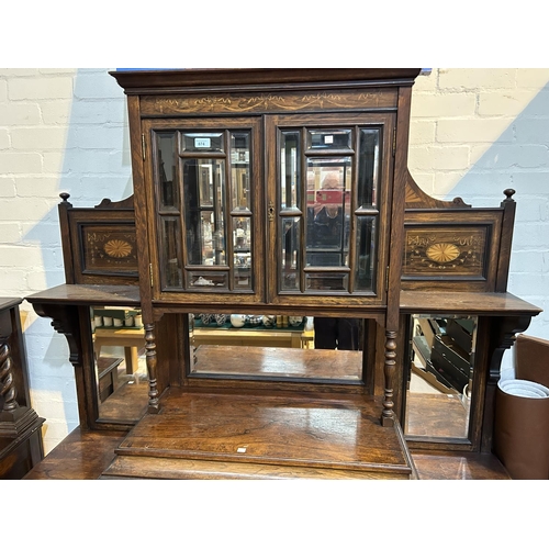 887 - A 19th century full height rosewood side cabinet with mirror back and extensive marquetry inlay, the... 