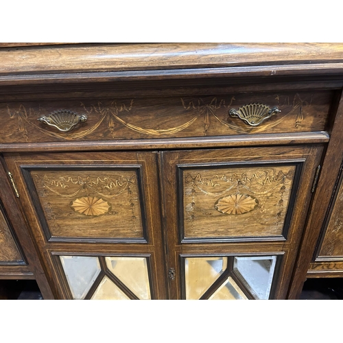 887 - A 19th century full height rosewood side cabinet with mirror back and extensive marquetry inlay, the... 