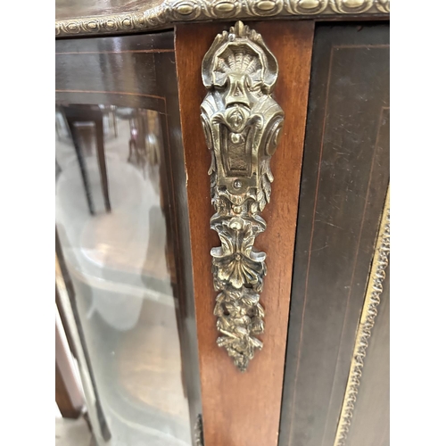 886 - A 19th century walnut 'D' end credenza with ormolu mounts and marquetry inlay, comprising 2 glazed s... 