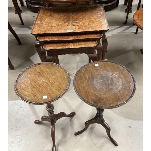 895 - A burr walnut nest of three occasional tables with rectangular dish tops and a pair of pedestal wine... 