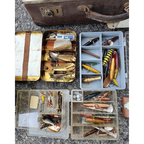 107 - A large collection of fishing lures, tackle, ball cocks etc and two reels