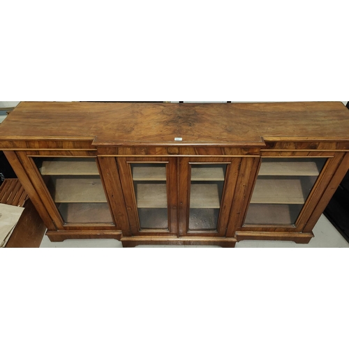 860 - A Victorian walnut breakfront side cabinet enclosed by 4 glazed doors on plinth base, length 198cm