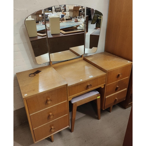 875 - A mid 20th century light oak dressing table and matching double wardrobe