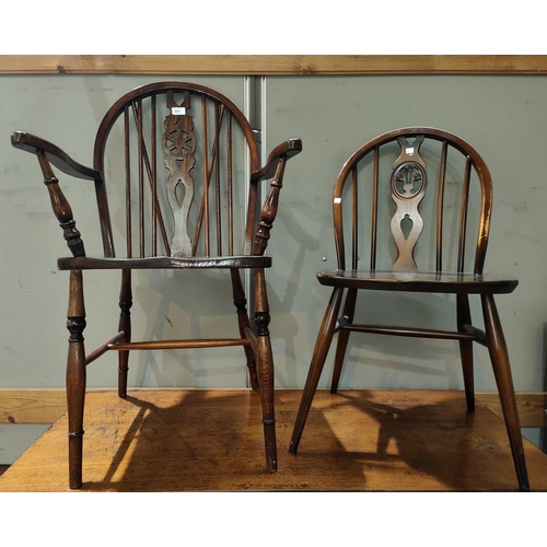 897 - A Windsor wheelback armchair; an Ercol dining chair; an Ercol lightwood stick back rocking chair