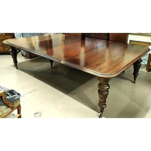 914 - Banqueting Dining Table: A mid 19th century large and impressive rounded rectangular mahogany wind o... 