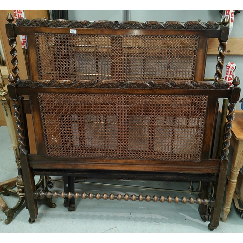 922 - A 1930s oak double bed with barley twist and bergère ends