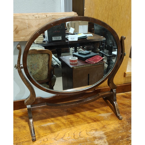 928 - An oval free standing dressing table mirror