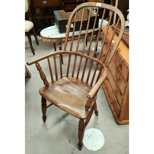 929 - A 19th century elm and ash Windsor stick back armchair on turned legs