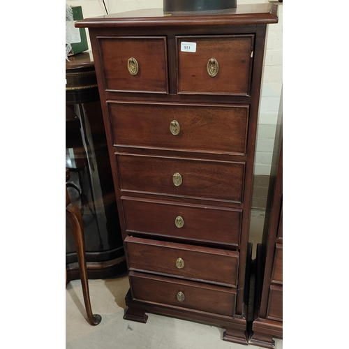 951 - A reproduction narrow mahogany chest of 7 drawers