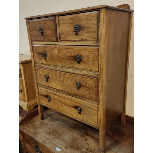 955 - A 1930's oak chest of drawers of 3 long and 2 short drawers