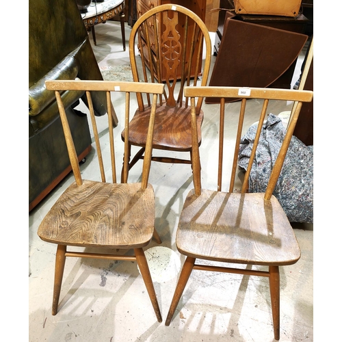 960 - A pair of 1960's Ercol stick back elm dining chairs; a pair of wheel back dining chairs