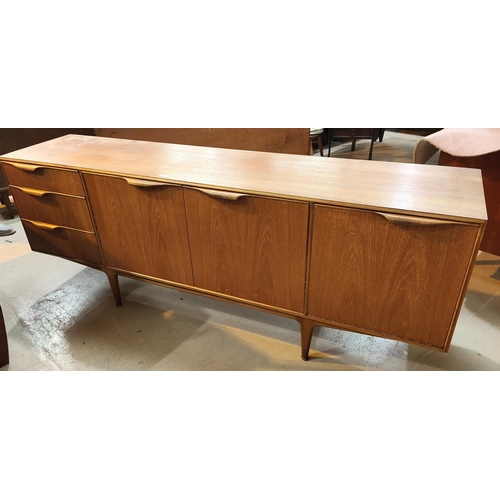 961 - A 1960's teak lowline sideboard by Mackintosh with 3 cupboards and 3 drawers