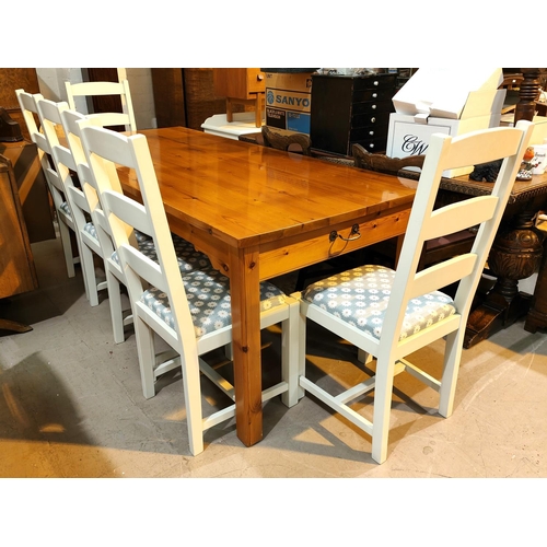 973 - A large rectangular pine dining table, square legs 200 x 90cm with 6 ladder back chairs in white